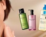 A graphic designed image featuring various cleansing oils including a La Roche-Posay foaming cleansing oil and a Kiehl’s Midnight Recovery cleansing oil.