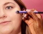 makeup artist applying makeup to a face
